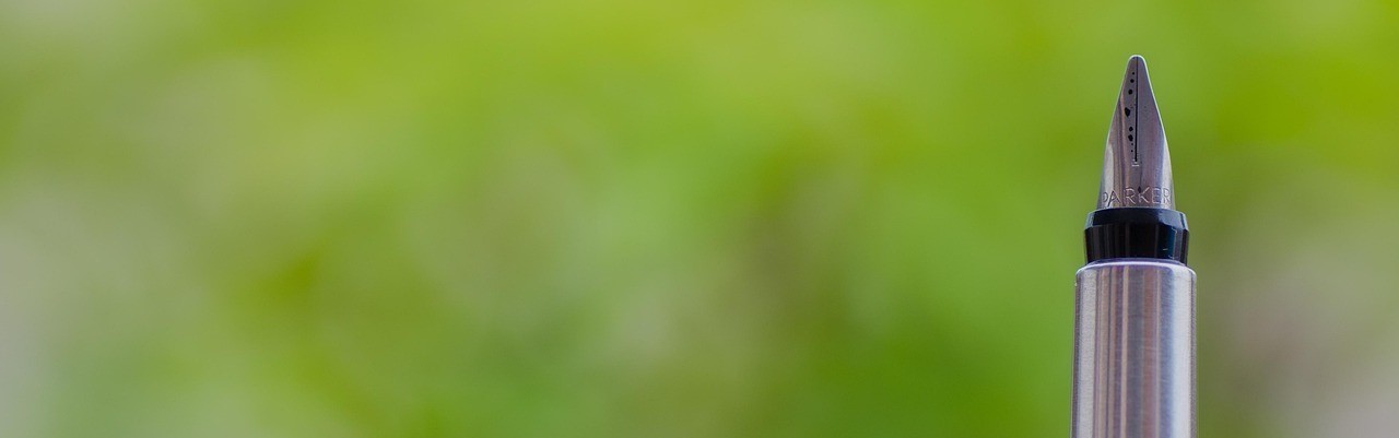 Fountain pen against green background