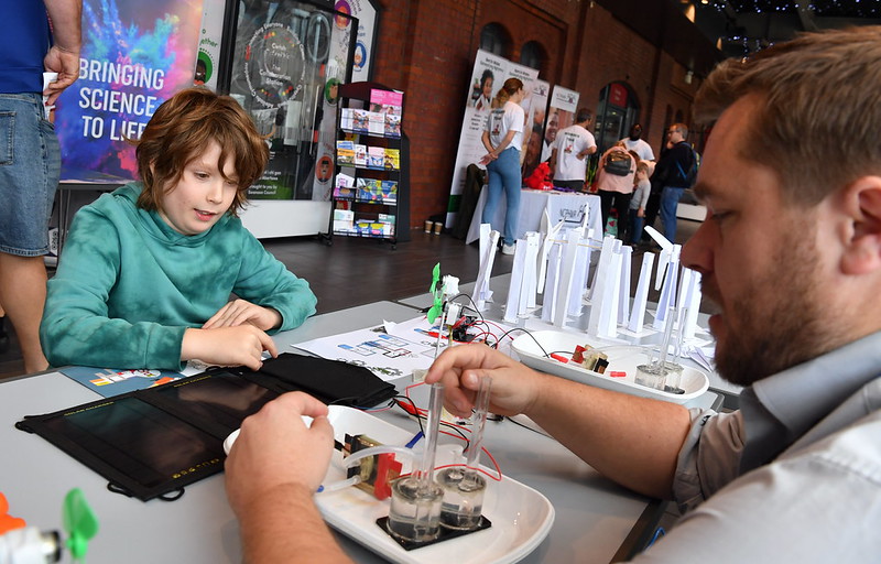 Boy watching science experiment