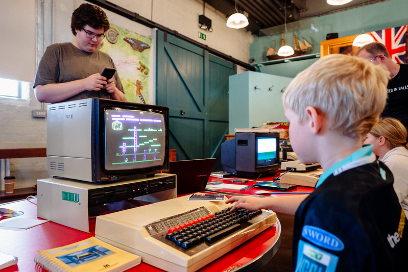 Boy looking at the old computer