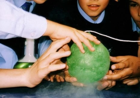 Children playing with the green ball