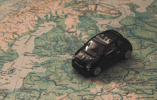 Toy car on map on europe
