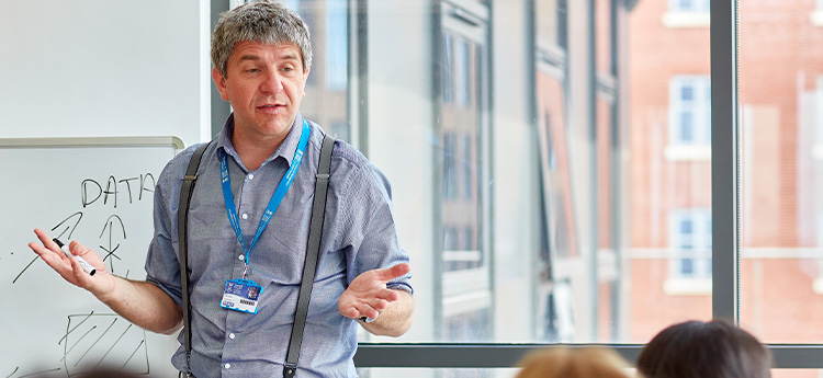 A teacher addressing students