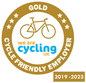 Cycle Friendly Employer Gold Standard logo. A gold circle with a white centre. In the centre is a gold bike with the words we are cycling uk. Around the outside are the words 'Gold Cycle Friendly Employer'.