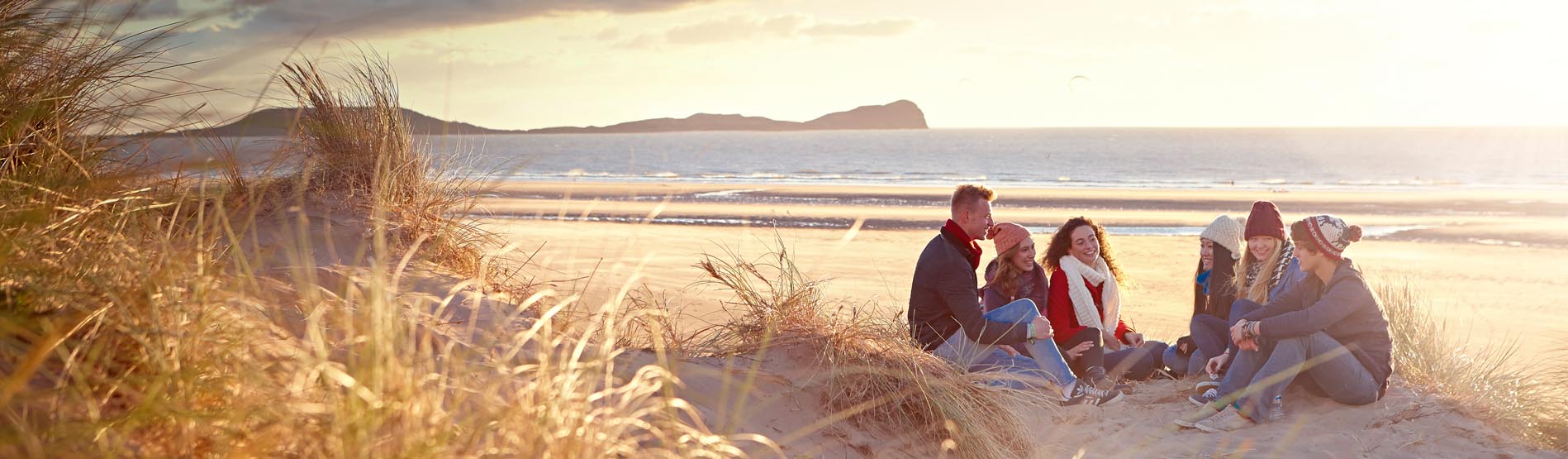 Students on the beach at Llangenntih on the Gower