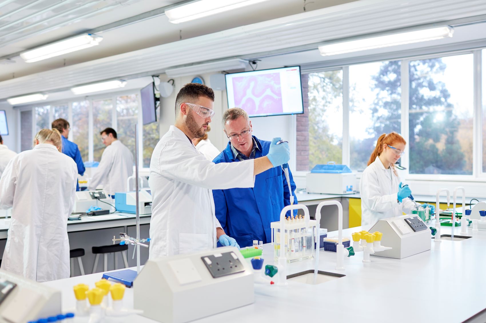 Teacher and student in a science laboratory