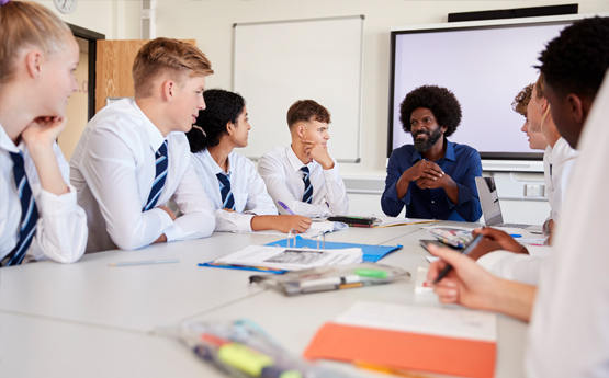 A teacher talking to a class of students