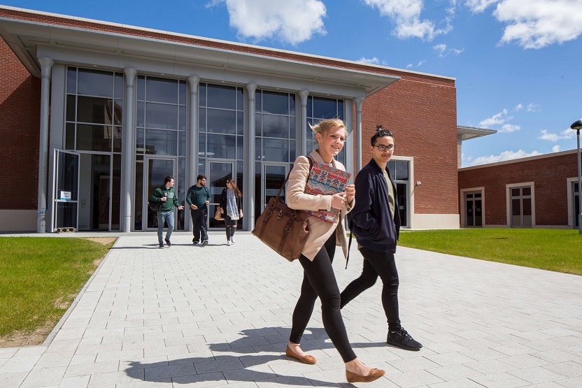 Students walking outside on Bay Campus. 