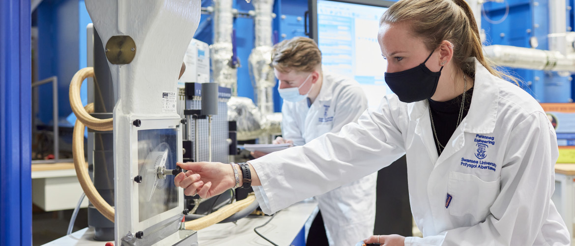 Engineering students working in labs