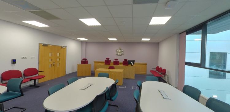 Courtroom with judge’s bench, seating and conference tables