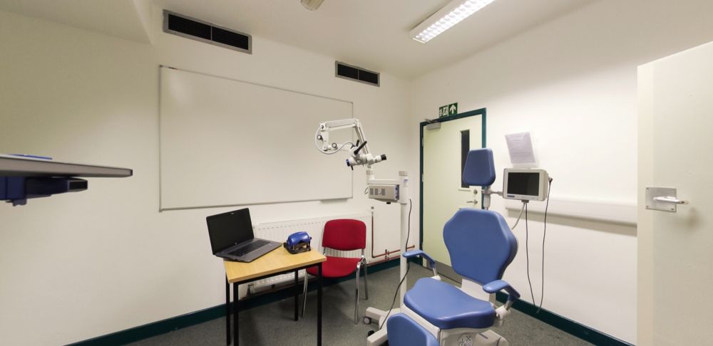 Audiology clinical practice booth with examination chair and equipment