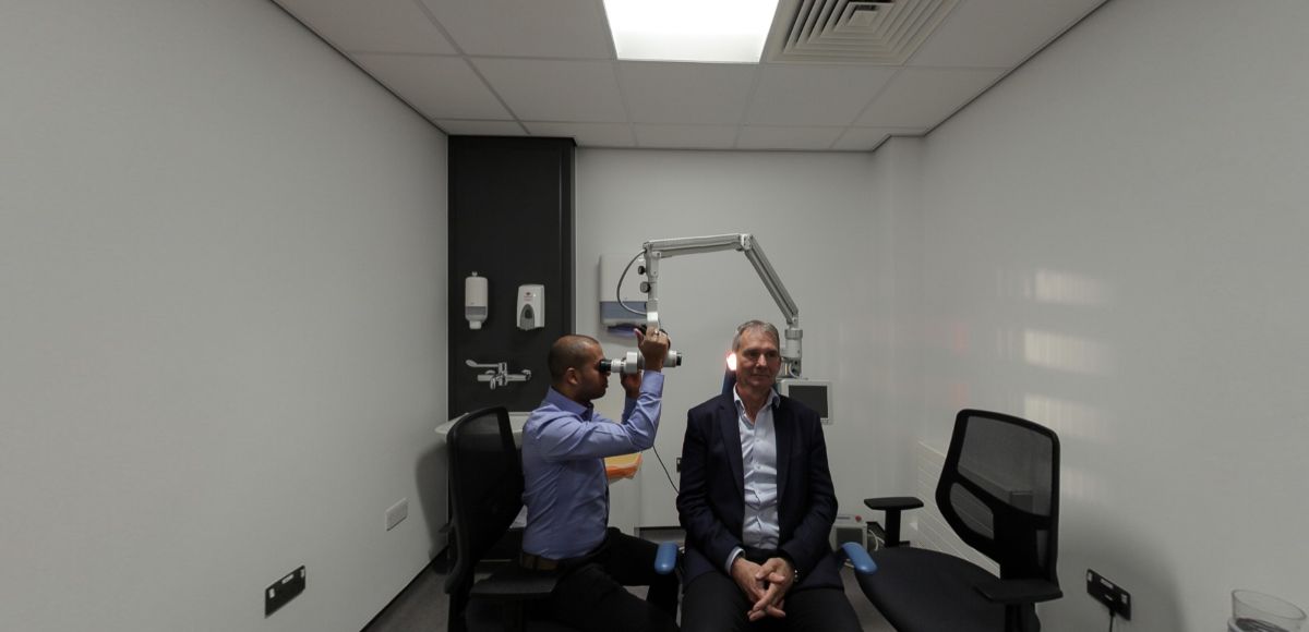Audiology microsuction room with ear examination equipment and seating