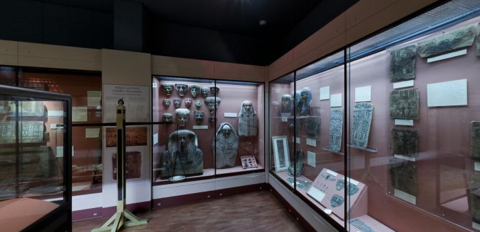 Egypt Centre display cases featuring ancient Egyptian artefacts and masks
