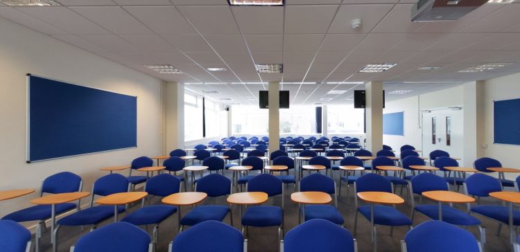 Lecture Room with tiered seating and individual writing desks
