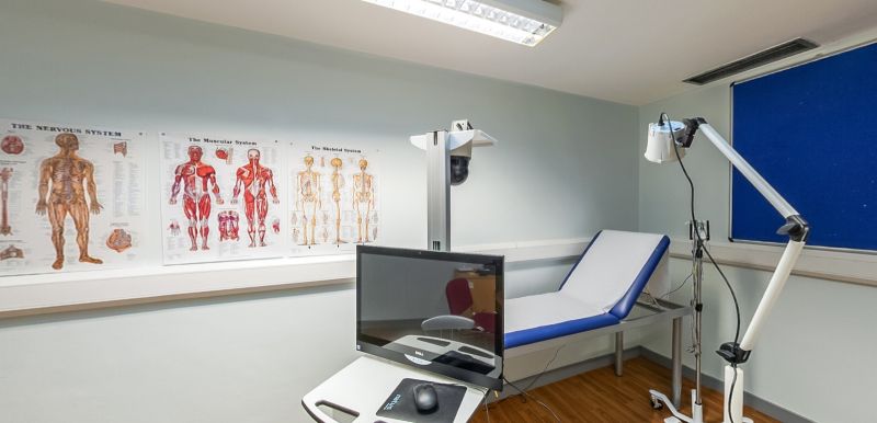 Neurophysiology examination room with treatment couch and monitoring equipment