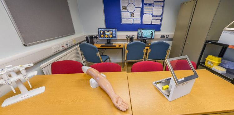 Medical physics lab with simulation equipment and computer workstations